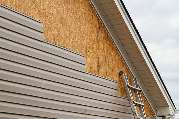 Professional Storm Damage Siding Repair technician working in Cordova, MD
